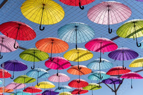 colorful umbrellas as a sunshade, colorful background of umbrellas of different colors