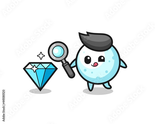 snow ball mascot is checking the authenticity of a diamond