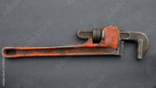 A Red Rusty Pipe Wrench