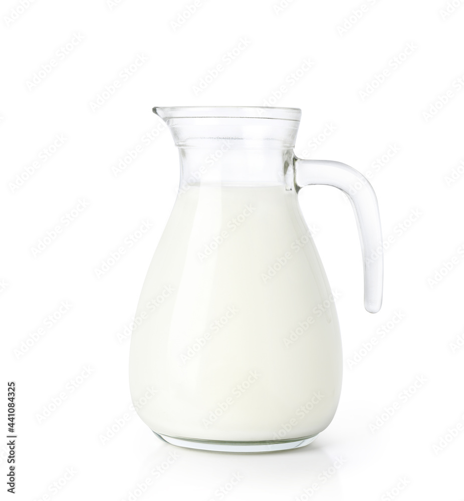 Glass jug of fresh milk isolated on white background. Clipping path. Glass jug of fresh milk isolated on white background. Clipping path.