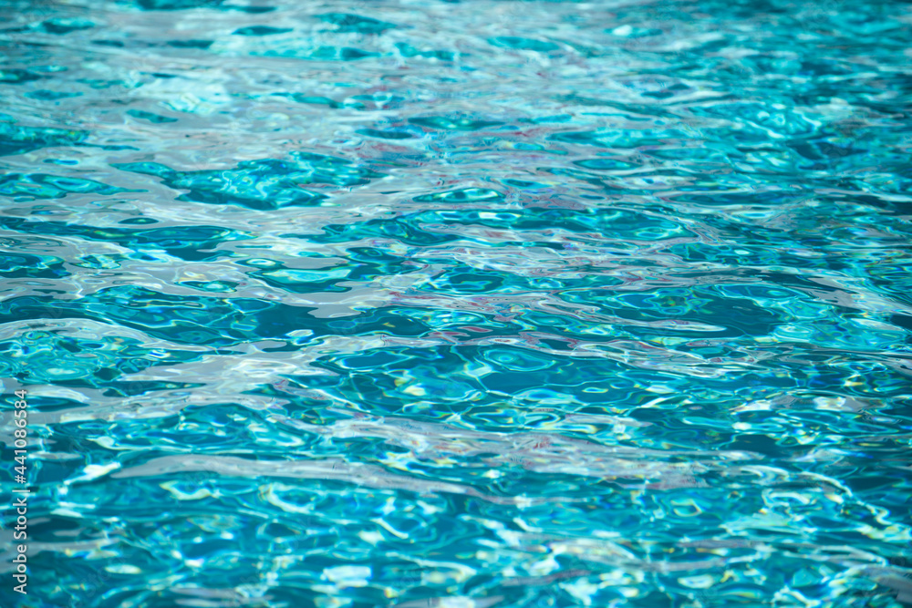 Abstract ripple wave and clear turquoise water surface in swimming pool, blue water wave for background and abstract design. Abstract ripple wave and clear turquoise water surface in swimming pool, blue water wave for background and abstract design.