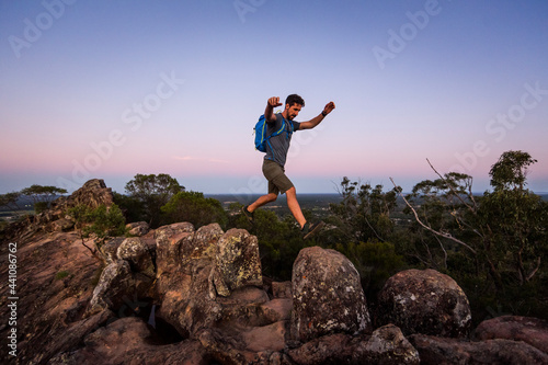Man leaping across rocks