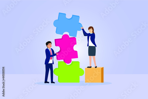 Concept of teamwork and partnership. Business people join puzzle pieces together.