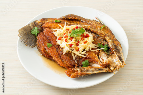 Fried Sea Bass Fish with Fish Sauce and Spicy Salad