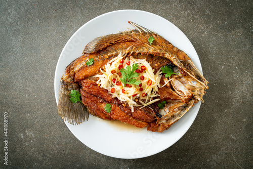 Fried Sea Bass Fish with Fish Sauce and Spicy Salad