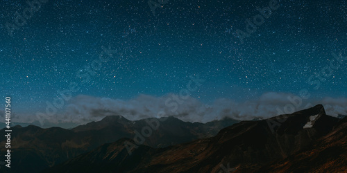 mountain. backgrounds night sky with stars and moon and clouds.