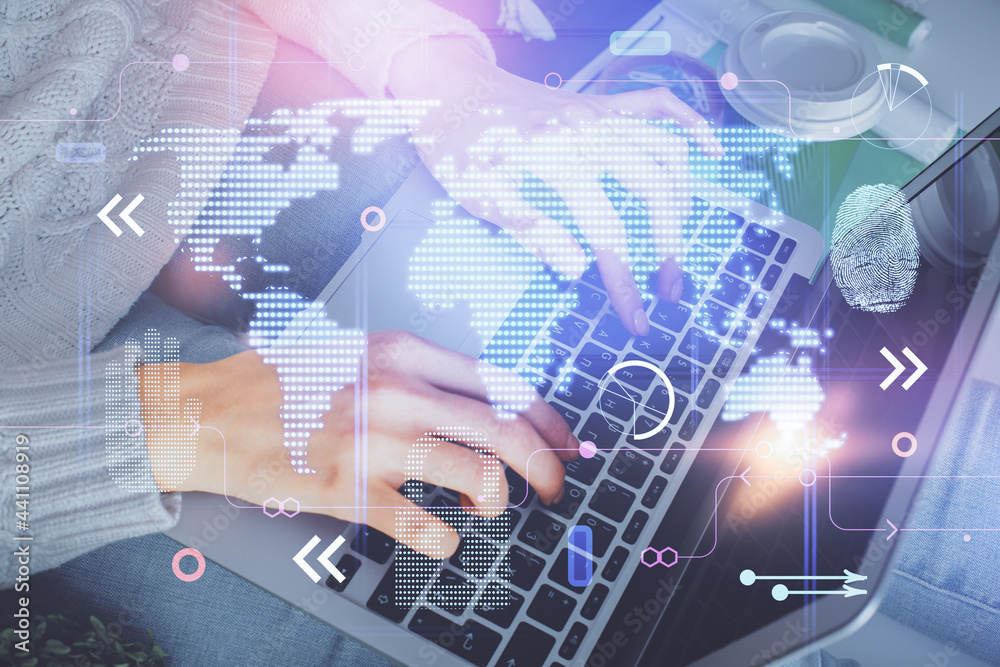 Double exposure of woman hands working on computer and world map hologram drawing. International technology business concept. Double exposure of woman hands working on computer and world map hologram drawing. International technology business concept.