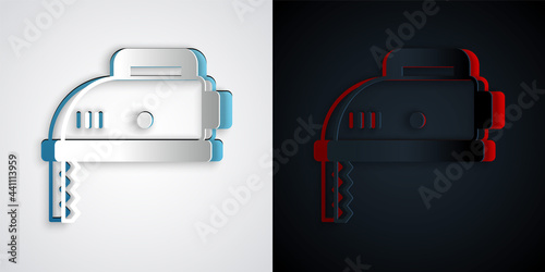 Paper cut Electric jigsaw with steel sharp blade icon isolated on grey and black background. Power tool for woodwork. Paper art style. Vector