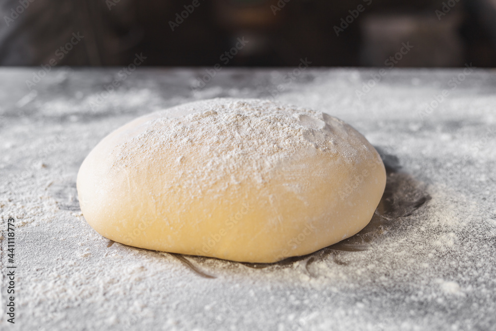  Dough makes fresh bread on the kitchen table.