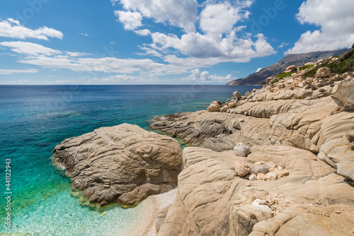 The famous white pebble beach called "Seichelles" on the south coast of the Greek island of Ikaria in the North Aegean