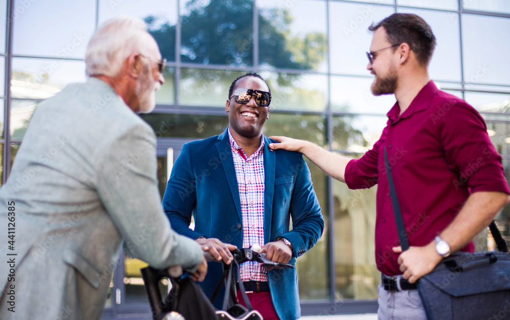 Small Group of business men talking on the street. Small Group of business men talking on the street.