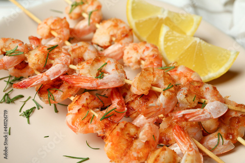 Concept of tasty eating with grilled shrimps, close up