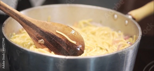 wooden spoon in noodles
