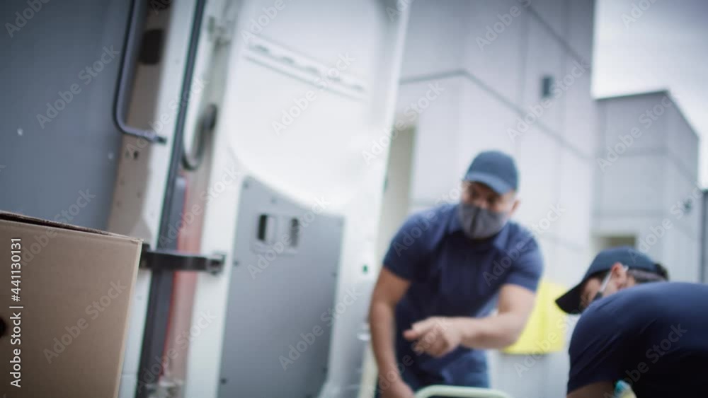 Video of couriers unloading packages during a pandemic. Shot with RED helium camera in 8K. Video of couriers unloading packages during a pandemic. Shot with RED helium camera in 8K.