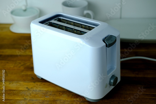 modern kitchen utensils, white toaster for cooking roasted sandwich toast, concept of healthy eating, dieting, snacking at work, at school, student fast food