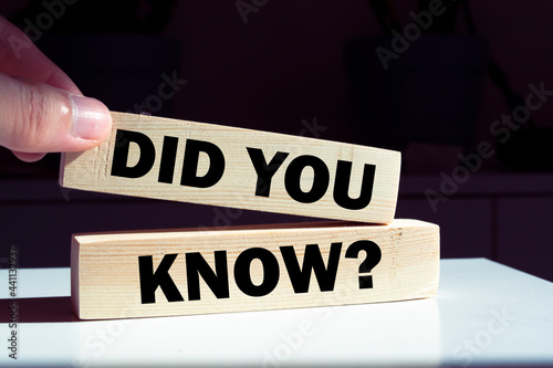 Did you know? symbol. Wooden blocks with words 'Did you know?' on beautiful orange background. Businessman hand. 