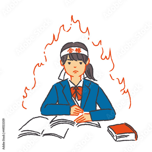 合格ハチマキをつけて勉強する女子学生