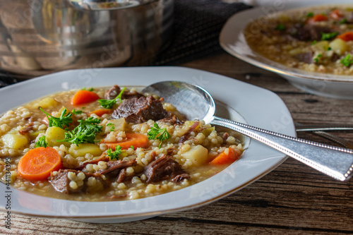Beef soup with pearl barley on a plate