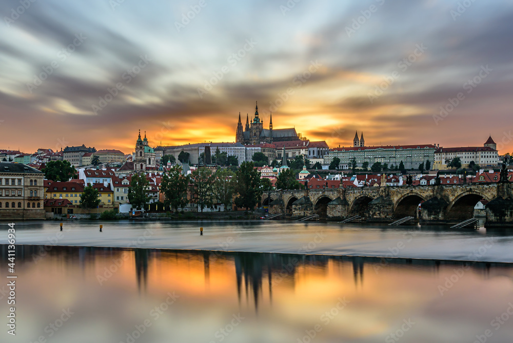 The famous Prague castle with the Charles bridge during a beautiful sunset.