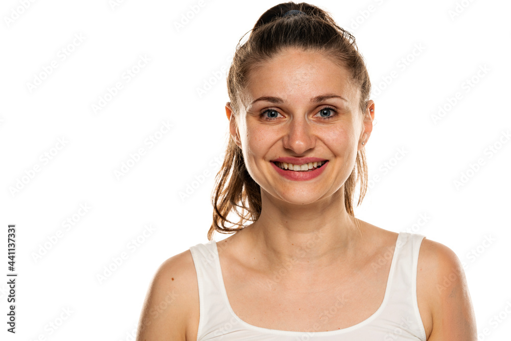 portrait of a smiling woman with blue eyes and no makeup portrait of a smiling woman with blue eyes and no makeup