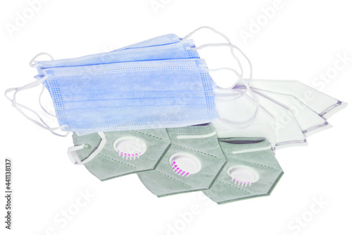 Coronavirus protective measures. Close-up of gray and white N95 face masks of the FFP3 protection class and blue surgical mask for protection from covid-19 virus isolated on a white background. Pandem photo
