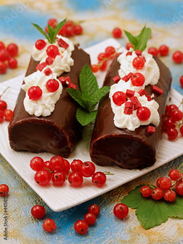 Swiss roll with chocolate and cream.