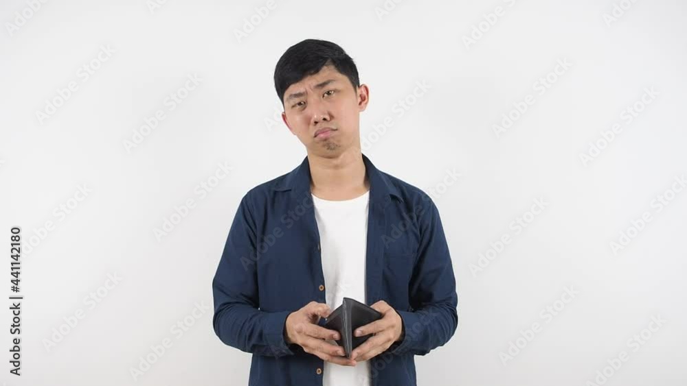 Asian man feeling sad with his wallet in hand poor man concept,Man no money in wallet white background Asian man feeling sad with his wallet in hand poor man concept,Man no money in wallet white background