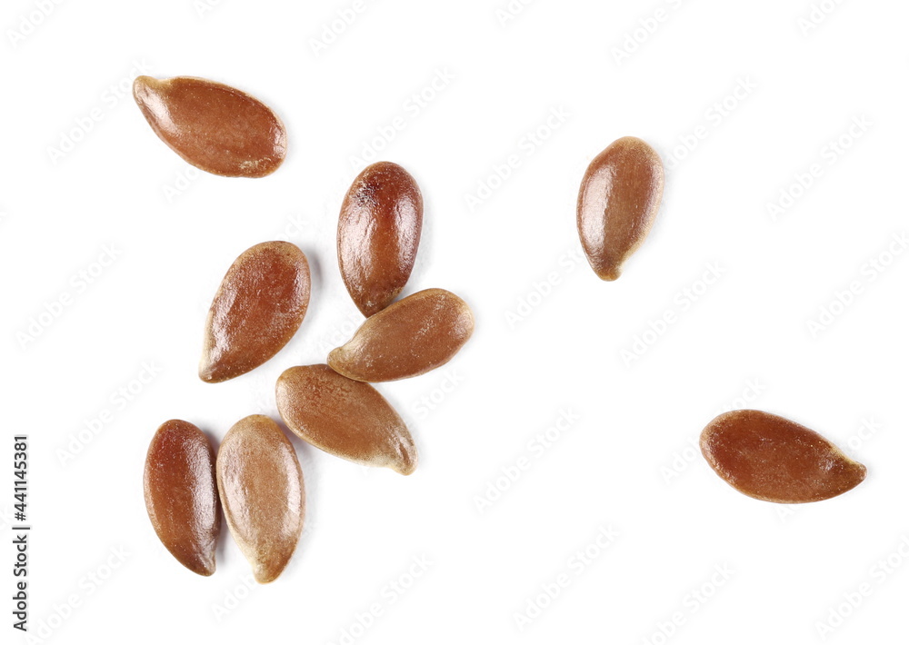 Brown flax seeds, linseed pile macro isolated on white background, top view Brown flax seeds, linseed pile macro isolated on white background, top view