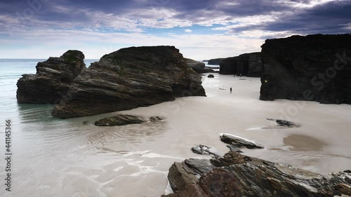 Beach of the Cathedrals, Playa las Catedrales in Ribadeo, province of Lugo, Galicia. Cliff formations on Cantabric coast in northern Spain. Tourist attraction.