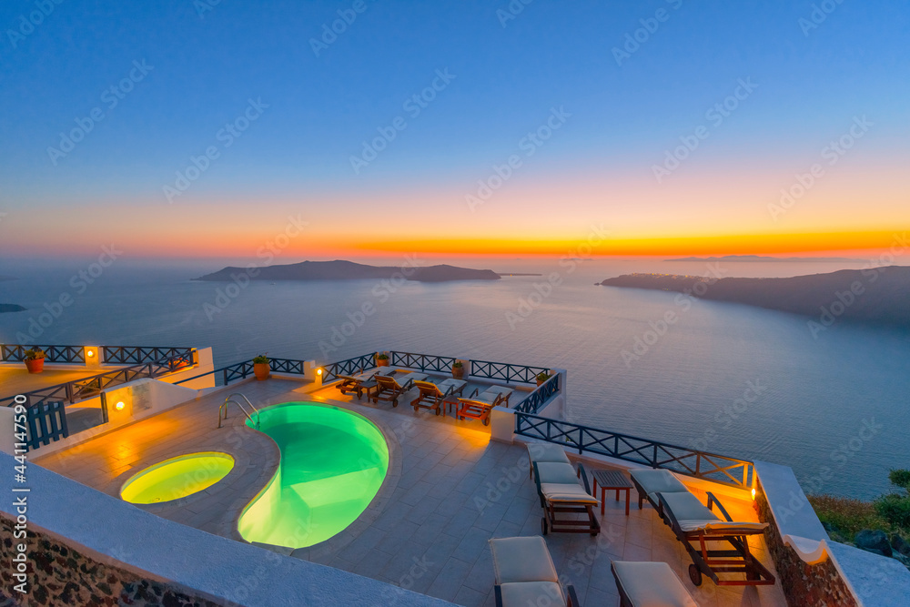 Greece famous santorini island in Cyclades, panoramic sea view of caldera at summer in front of swimming pools