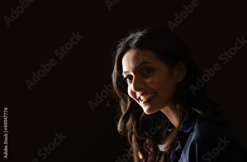 Portrait of a beautiful woman on a dark background