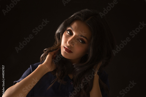 Portrait of a beautiful woman on a dark background