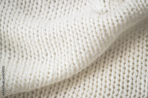 Background Of Knitted Fabric Of Wool With Patterns Close Up.