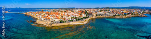 Aerial view over Alghero old town, cityscape Alghero view on a beautiful day with harbor and open sea in view. Alghero, Italy. Panoramic aerial view of Alghero, Sardinia, Italy. photo