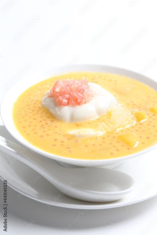 chilled mango sago fruit with pomelo and soya pudding jelly in white bowl sweet dessert menu chilled mango sago fruit with pomelo and soya pudding jelly in white bowl sweet dessert menu