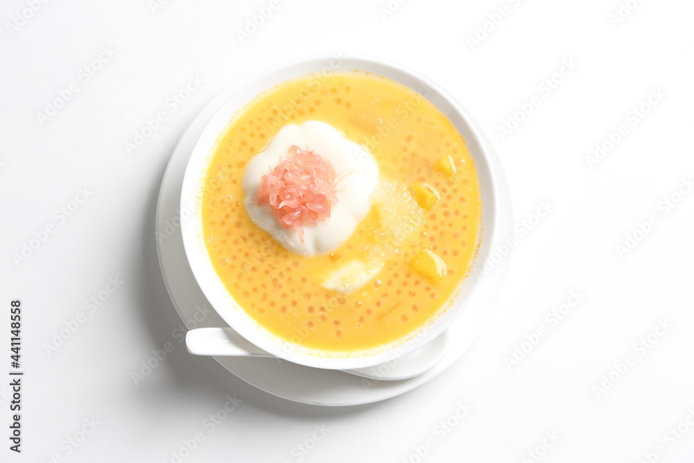 chilled mango sago fruit with pomelo and soya pudding jelly in white bowl sweet dessert menu chilled mango sago fruit with pomelo and soya pudding jelly in white bowl sweet dessert menu
