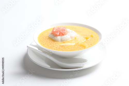 chilled mango sago fruit with pomelo and soya pudding jelly in white bowl sweet dessert menu