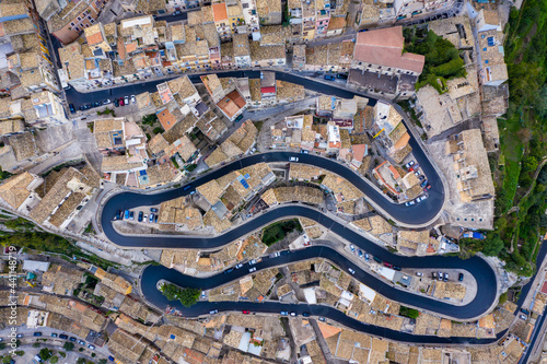 Aerial view of the old town of Ragusa Ibla and a winding road. View from above of the city in Ragusa Ibla, Province of Ragusa, Val di Noto, Sicily, Italy.