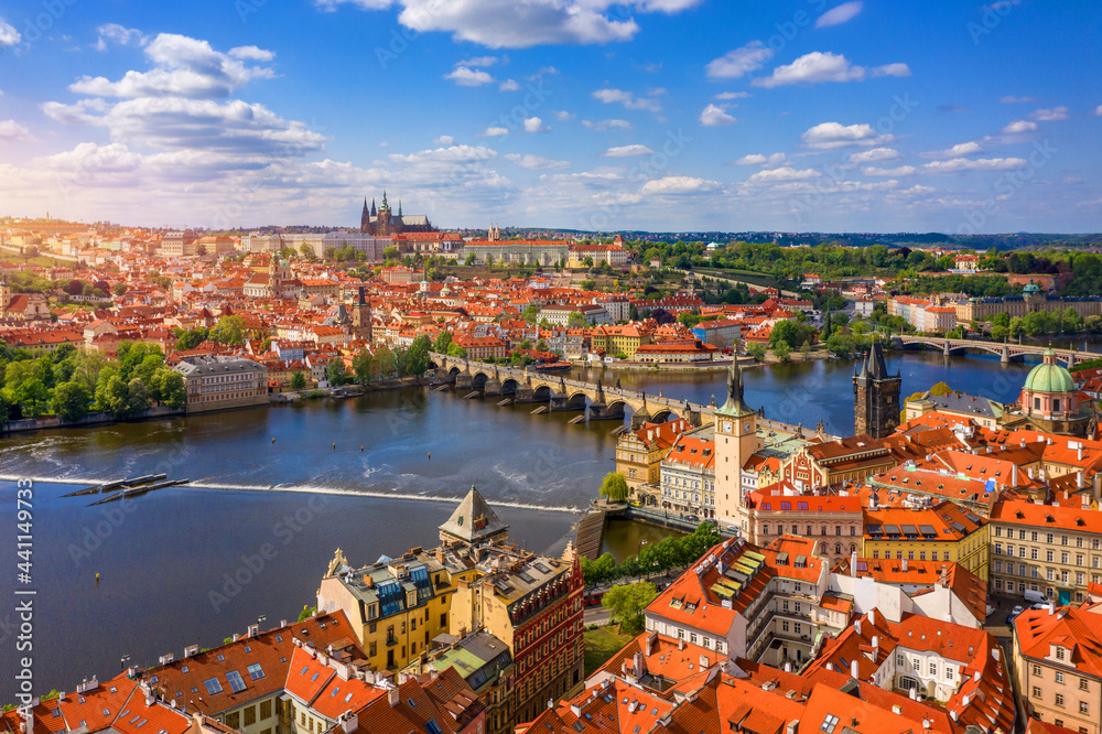 Obraz premium Prague scenic spring aerial view of the Prague Old Town pier architecture Charles Bridge over Vltava river in Prague, Czechia. Old Town of Prague with the Castle in the background, Czech Republic.