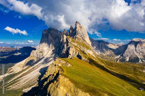 Drone view on Seceda peak. Trentino Alto Adige, Dolomites Alps, South Tyrol, Italy. Odle mountain range, Val Gardena. Majestic Furchetta peak. Odles group seen from Seceda, Santa Cristina Val Gardena. photo