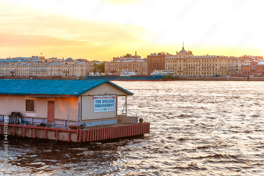 The pier on the river in St. Petersburg at sunset. Beautiful panorama. Saint Petersburg, Russia - 05 June 2021