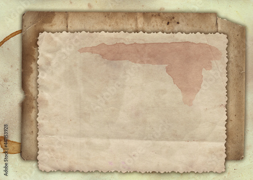 Old vintage paper with scratches and coffee stain texture isolated on white