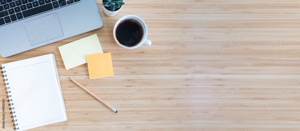flat lay composition with notebook, pen, coffee, plant, laptop on wood background. top view flat lay composition with notebook, pen, coffee, plant, laptop on wood background. top view