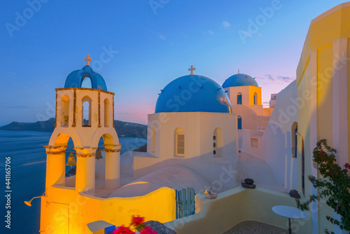 Greece Santorini island in Cyclades, wide view of white washed colorful houses at night