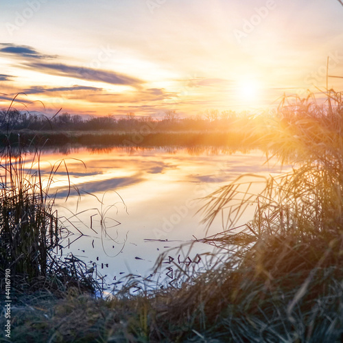 Beautiful sunset over a small river. Evening landscape