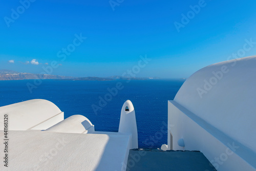 Stunning cupolas with the Caldera (volcano) in the distance in the Greek island of Santorini