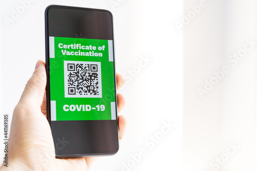 A man shows a qr code in a smartphone containing information about vaccination against coronavirus