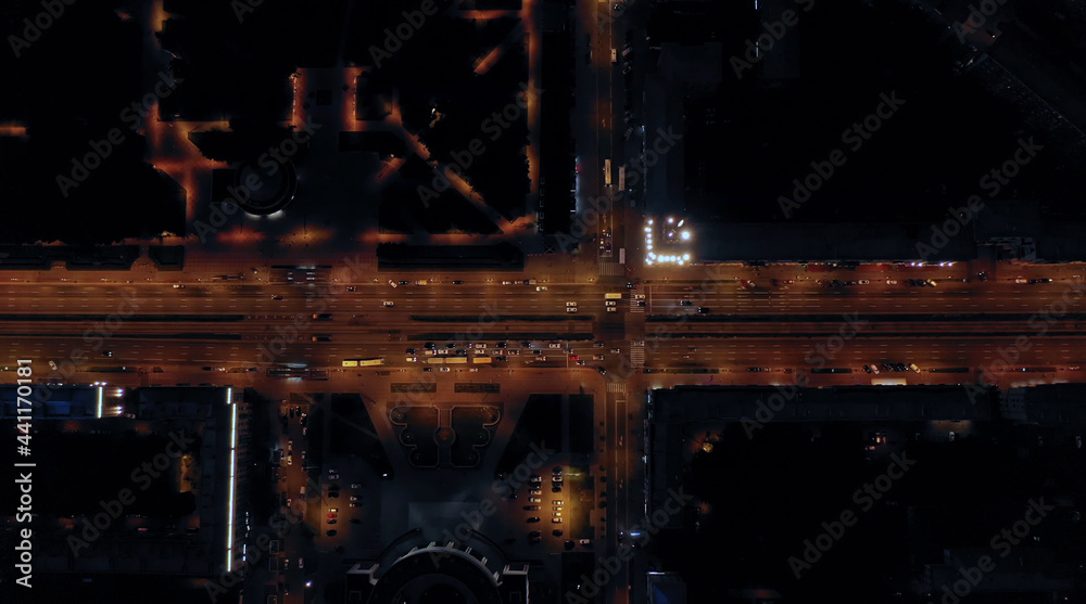 Aerial view of the fascinating cityscape of a long highway with burning lights