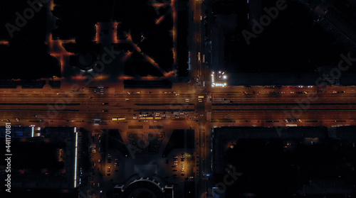 Aerial view of the fascinating cityscape of a long highway with burning lights