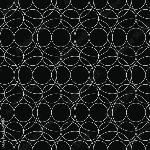 Empty circles. Vector white rings and black background.